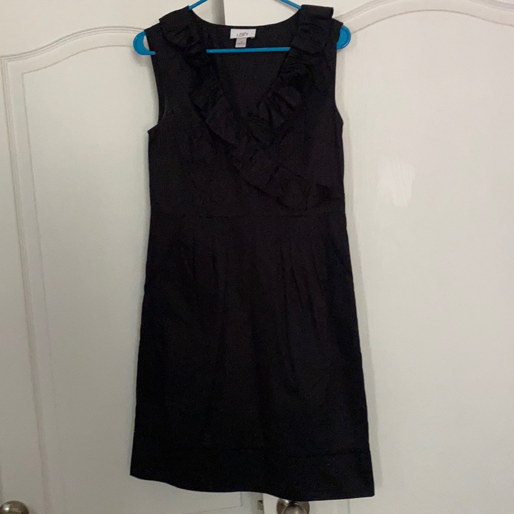 Black Loft dress. Ruffle detail with pockets. Size 6.